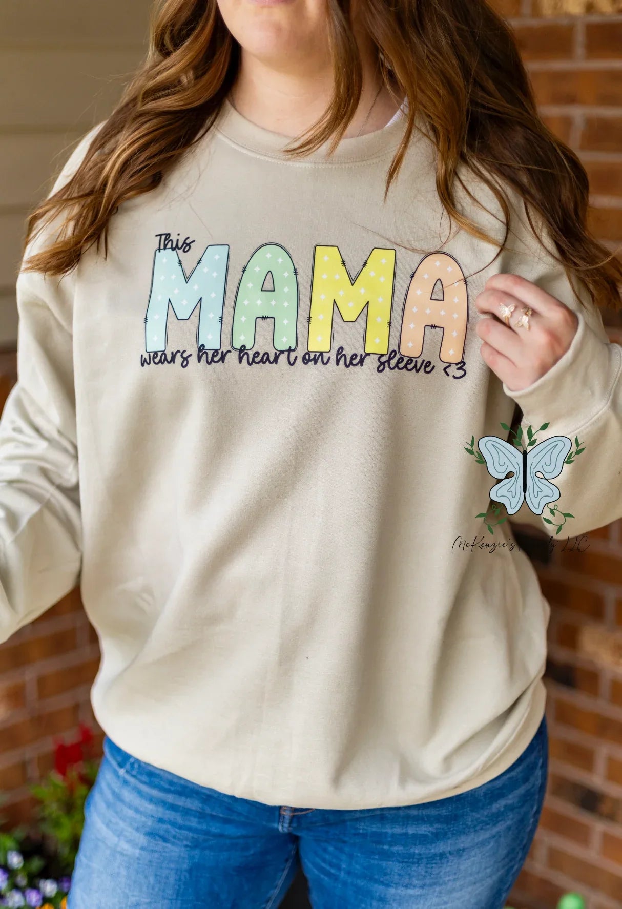 This Mama Wears Her Heart On Her Sleeve - Personalized Sleeve Crewneck Sweatshirt - McKenzie's Infinity