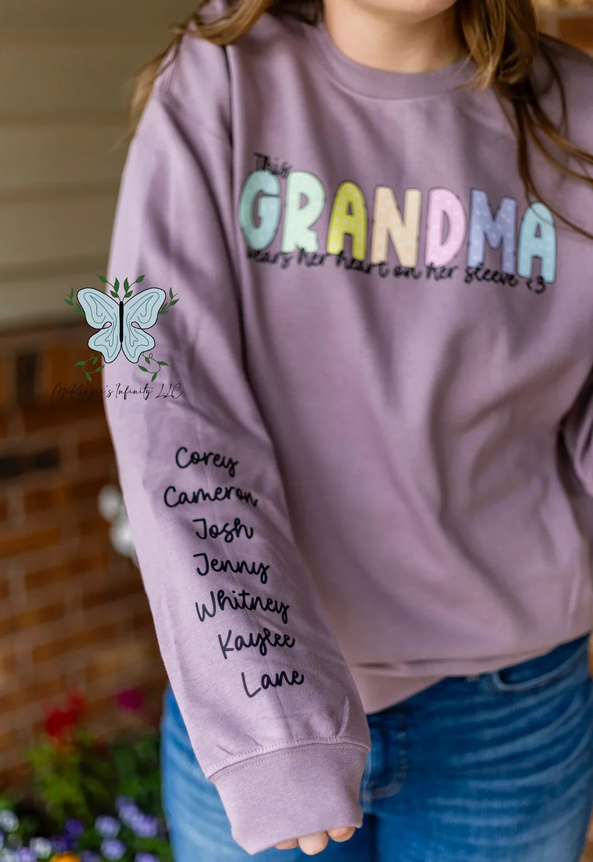 This Grandma Wears Her Heart On Her Sleeve - Personalized Sleeve Crewneck Sweatshirt - McKenzie's Infinity