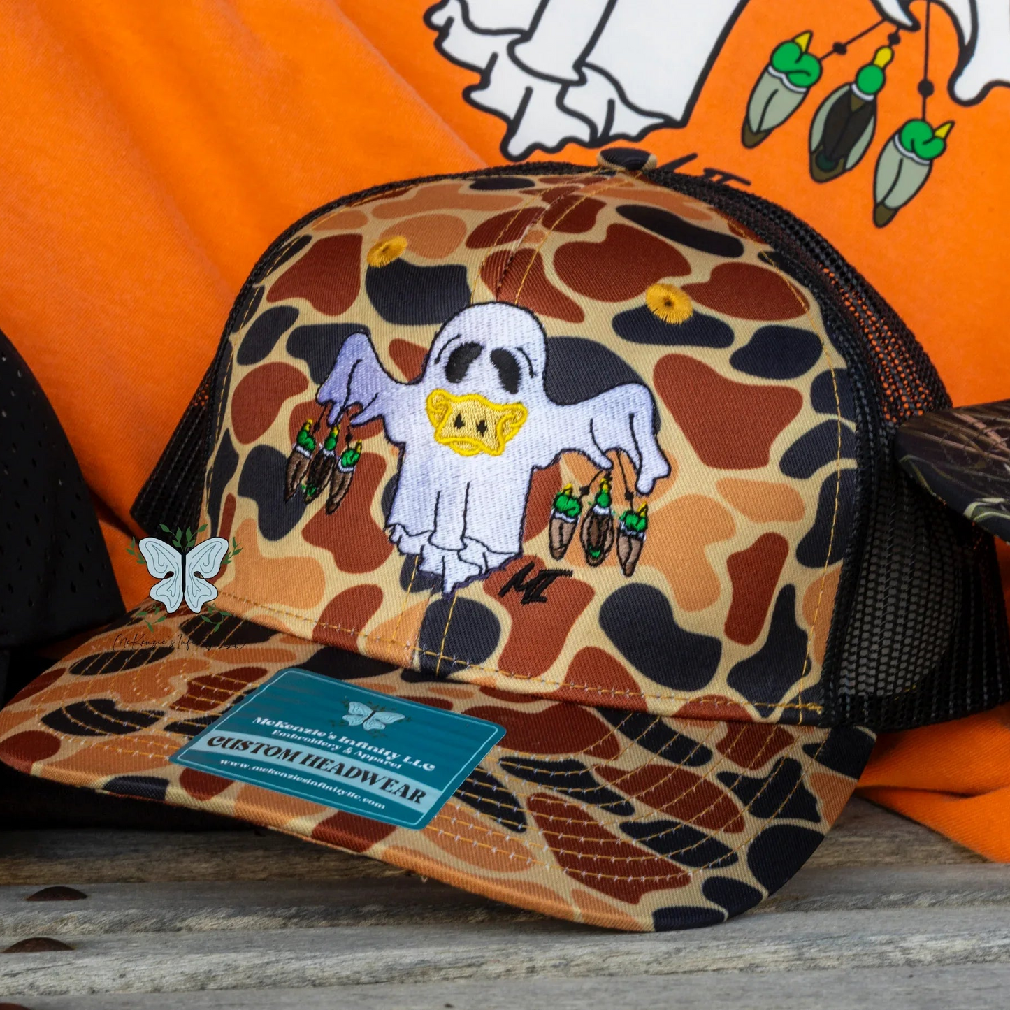 "Remi" Duck Hunting Ghost - Embroidered Old School Orange Camo Trucker Hat/Cap ©️ - McKenzie's Infinity