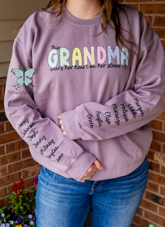 This Grandma Wears Her Heart On Her Sleeve - Personalized Sleeve Crewneck Sweatshirt